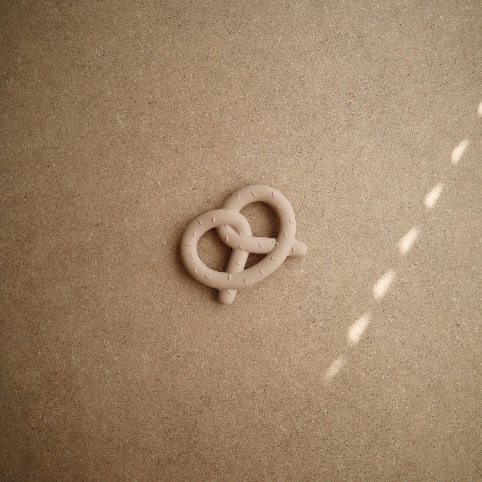 Anneau de dentiton bretzel
